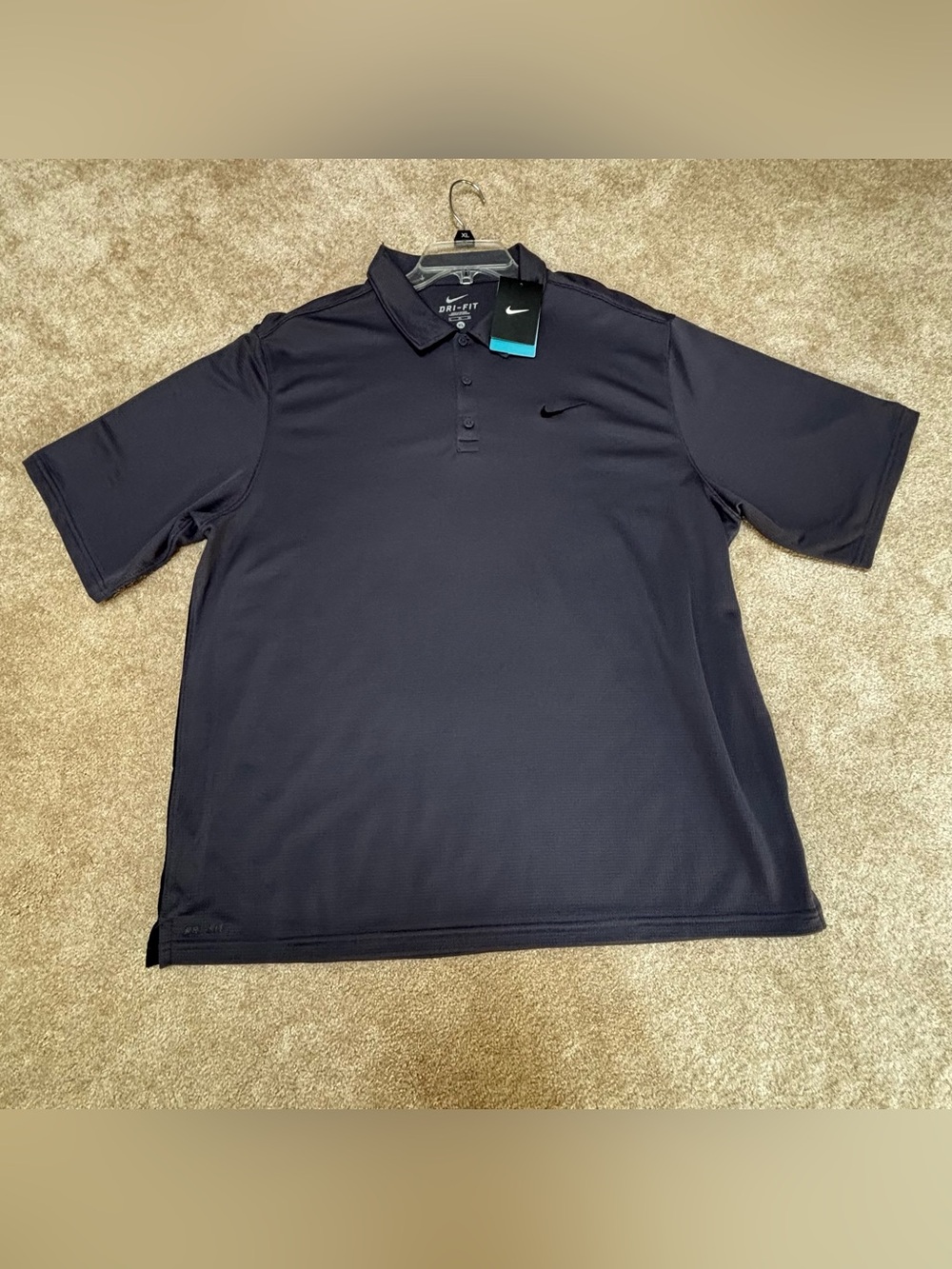 Nike dry-fit Men’s Polo Shirt - navy blue NWT.  tiny snags lower back see pics